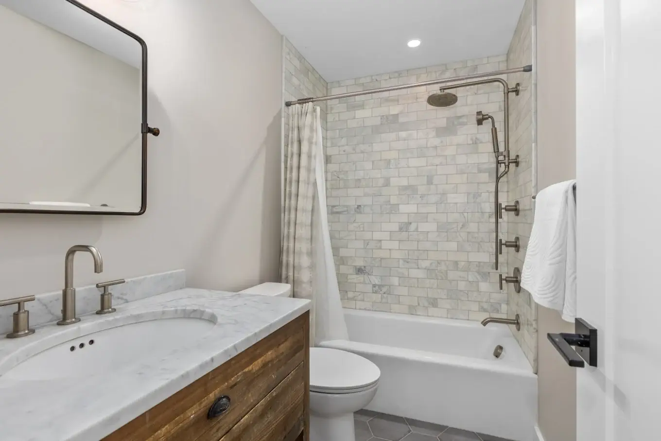 Crew members lifting a beam during framing work