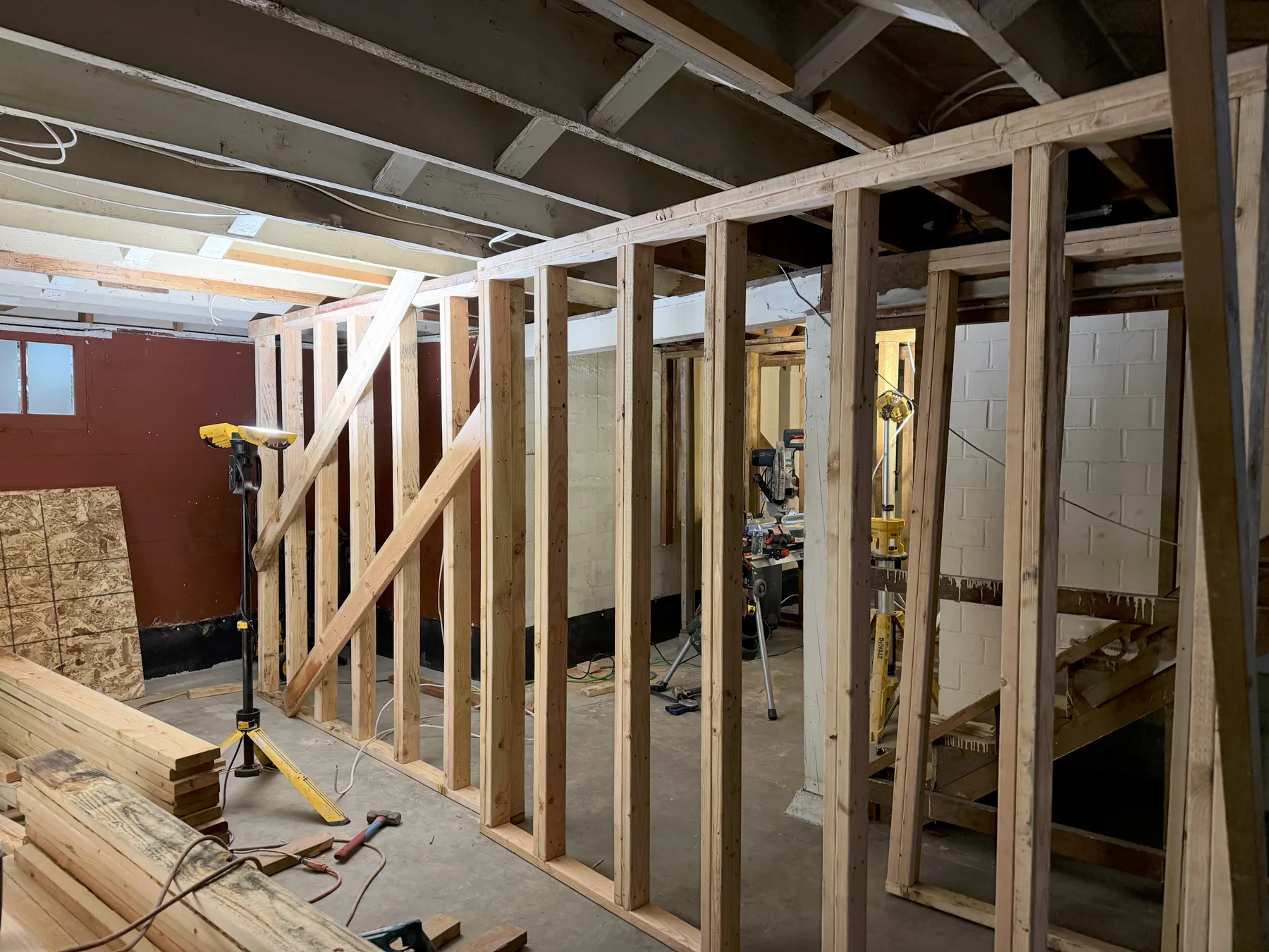 Temporary wood support walls beside the basement stair