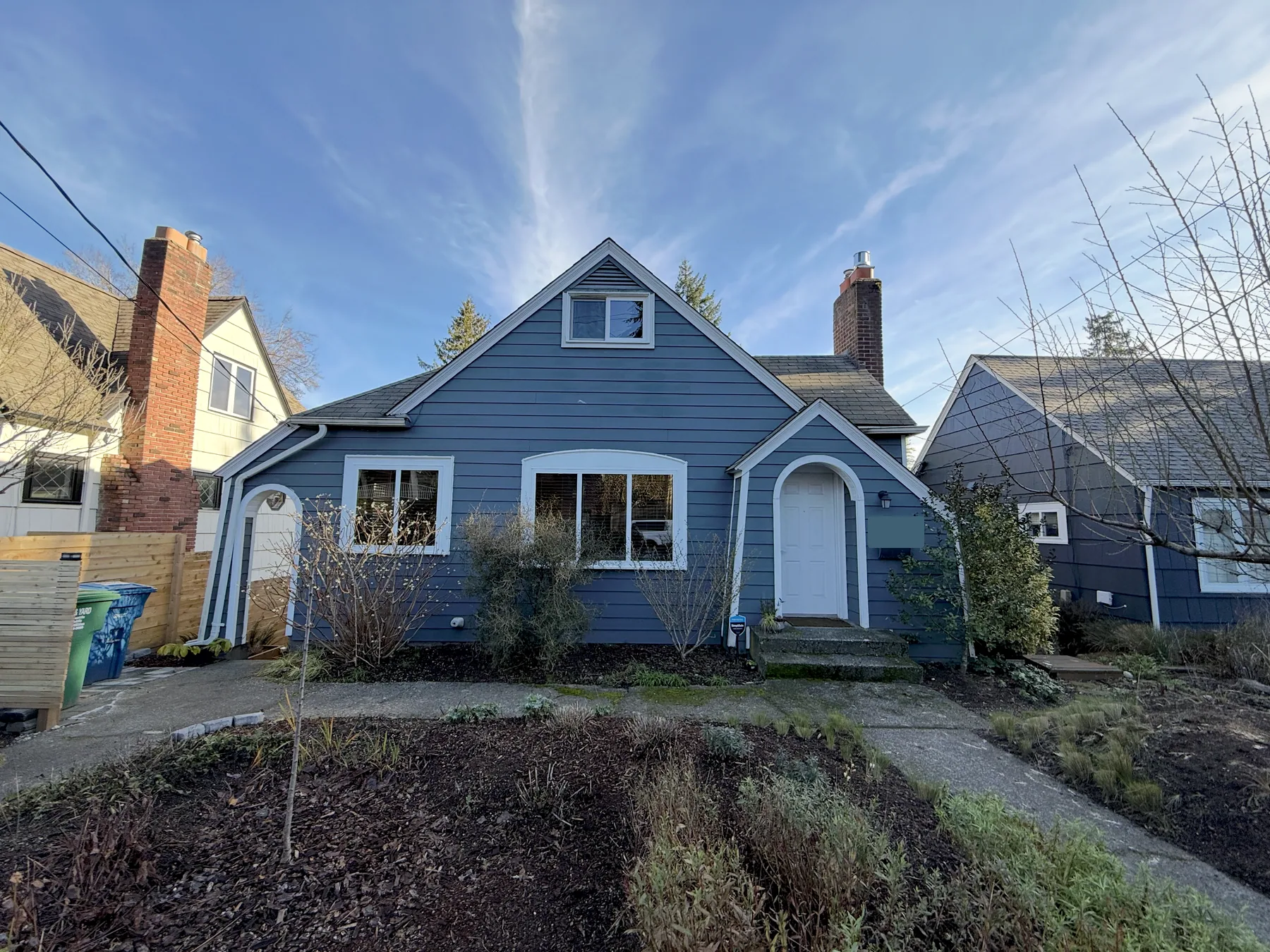 Blue Ravenna house exterior with the street number covered for privacy
