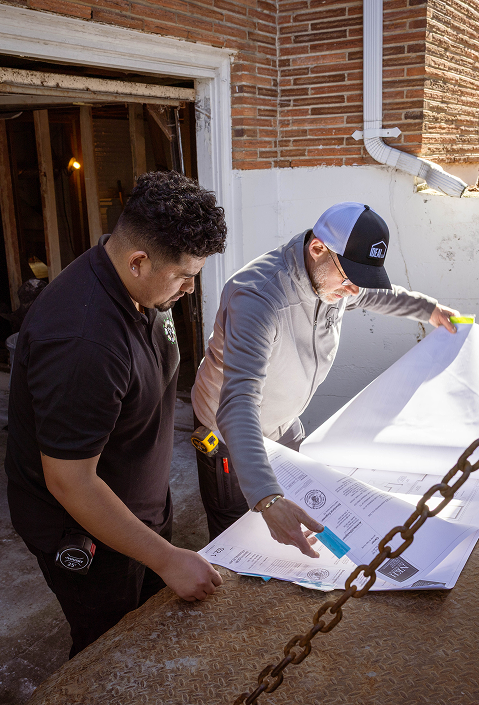 Team member working beside a reinforced wall opening