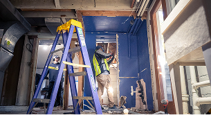 Crew preparing the floor area during demolition work