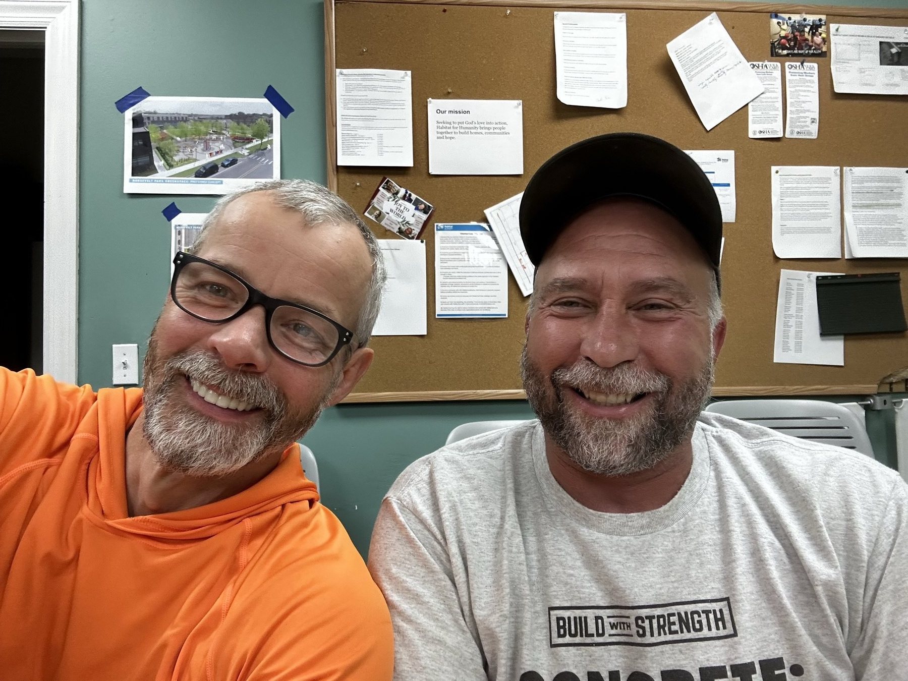 Christian with a Habitat for Humanity colleague during his construction site supervisor work