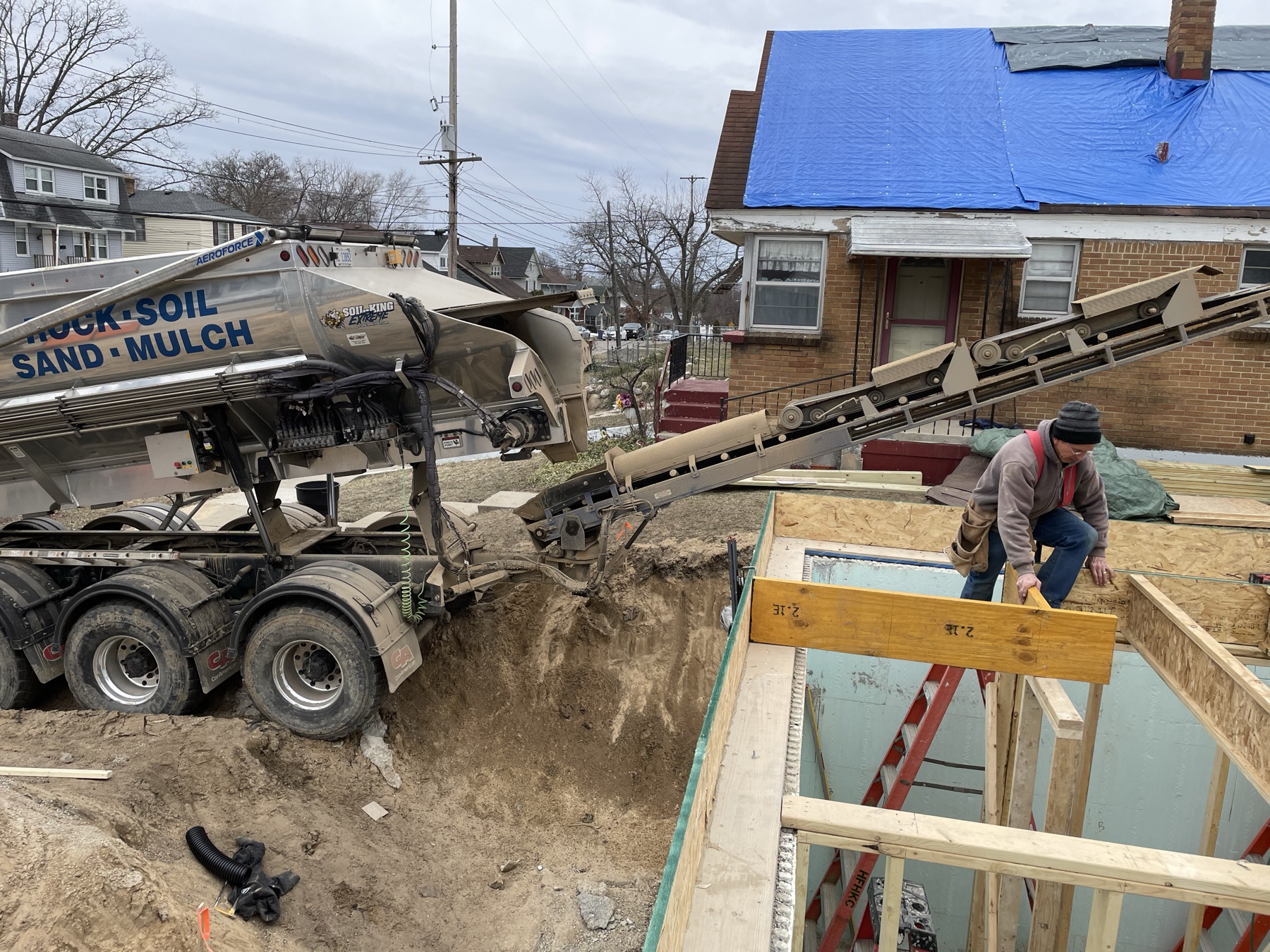 Habitat crew framing the floor system above the foundation