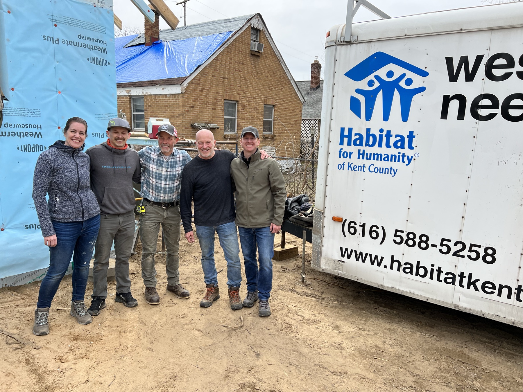 Christian and a Habitat for Humanity construction team in Grand Rapids