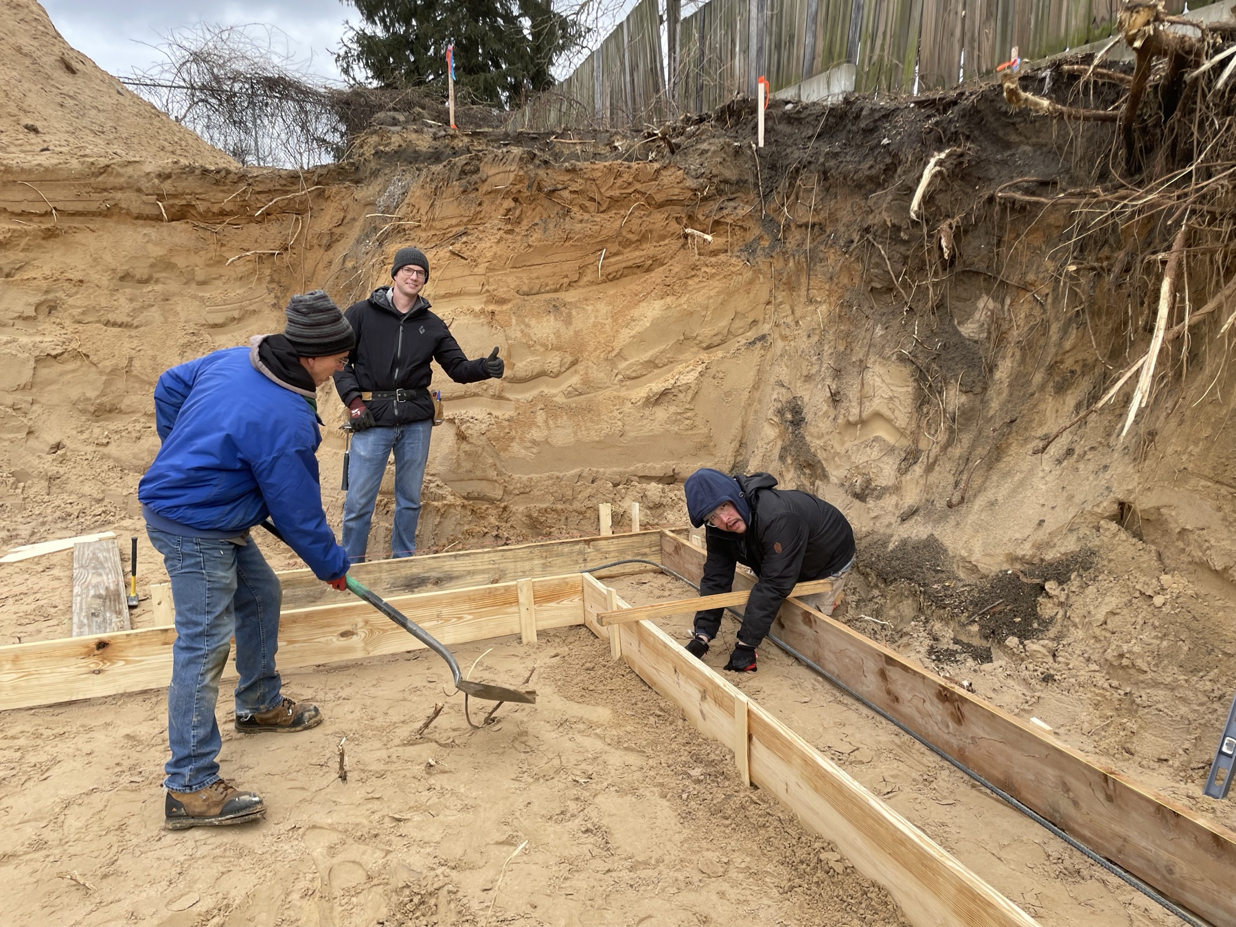 Crew members laying out footings for a Habitat home